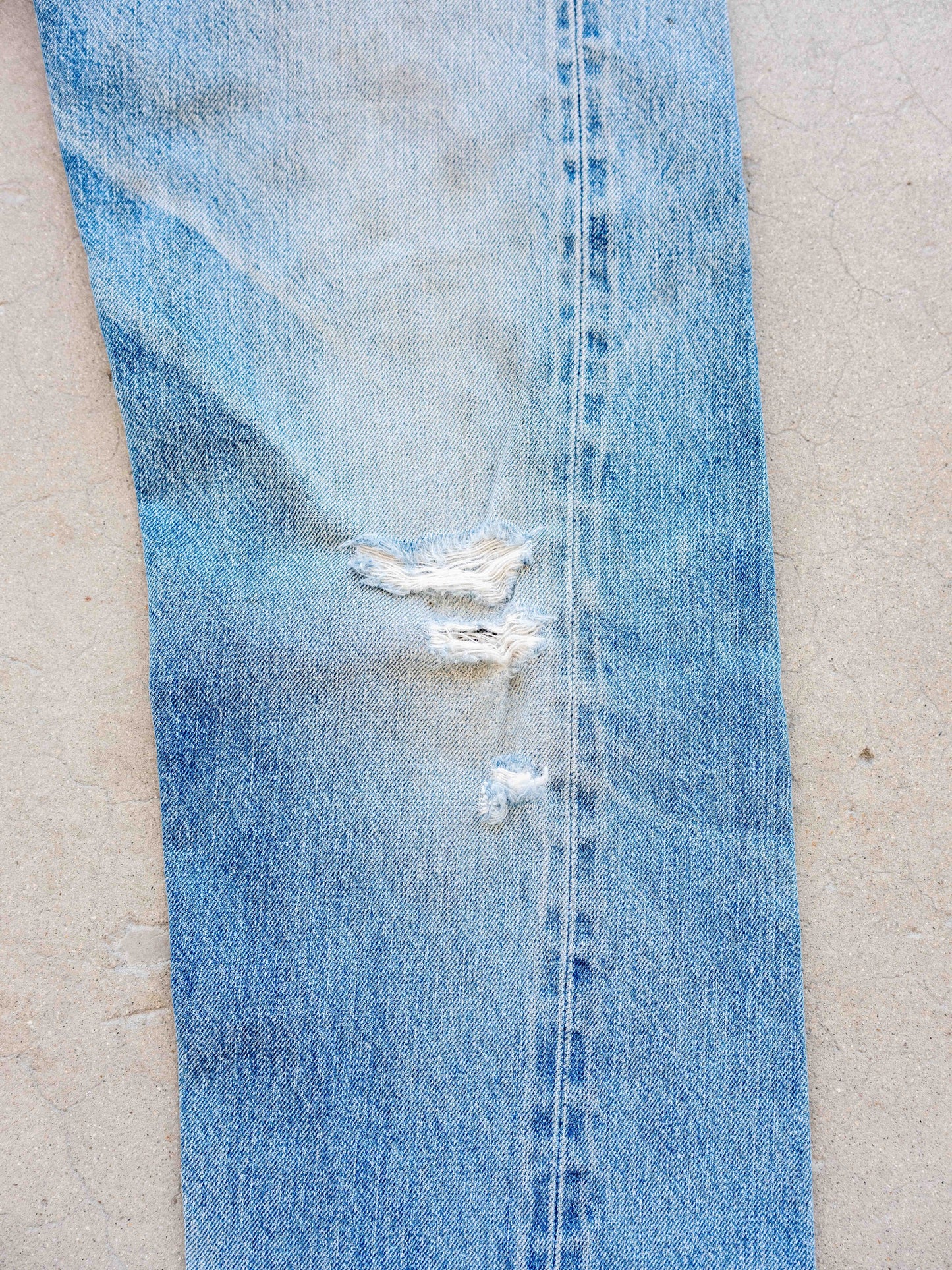 1980’s Levi’s 501 Redlines in a Light Midwash with Dirt and Rips 32W